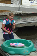 Emmalee Haga demonstrating the importance of weight distribution in a boat
